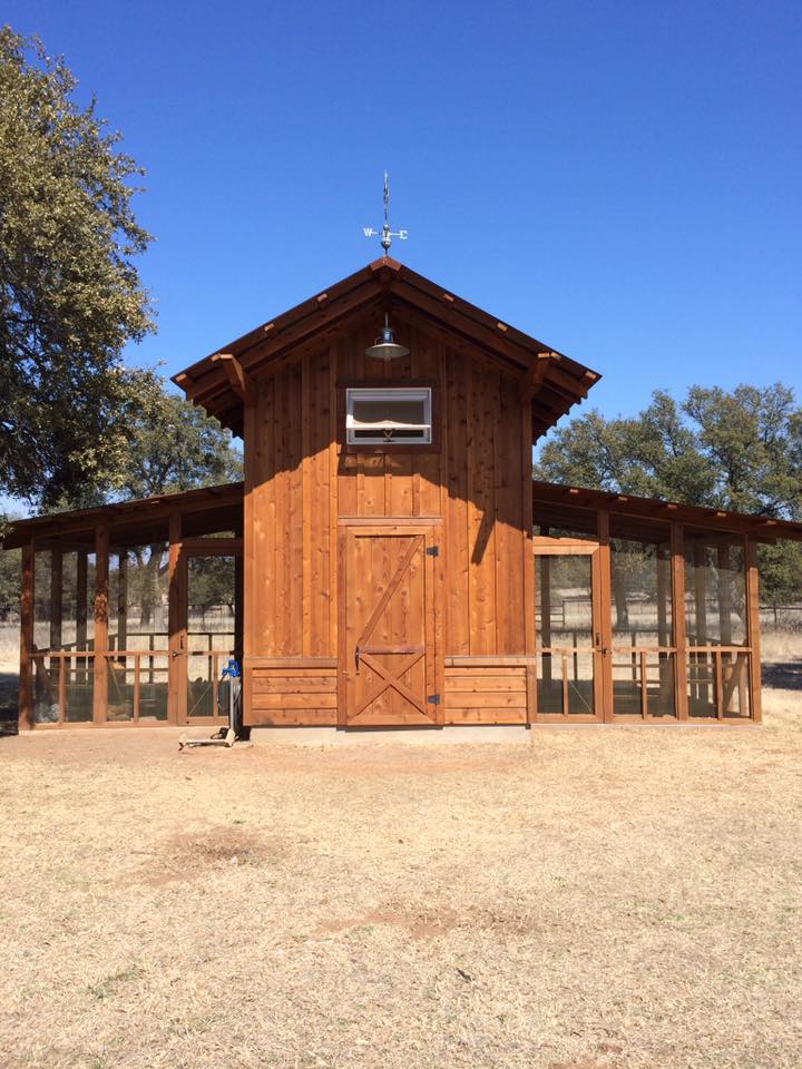 Custom cedar barn with board-and-batten siding and screened porches — metal building project by Tincher's