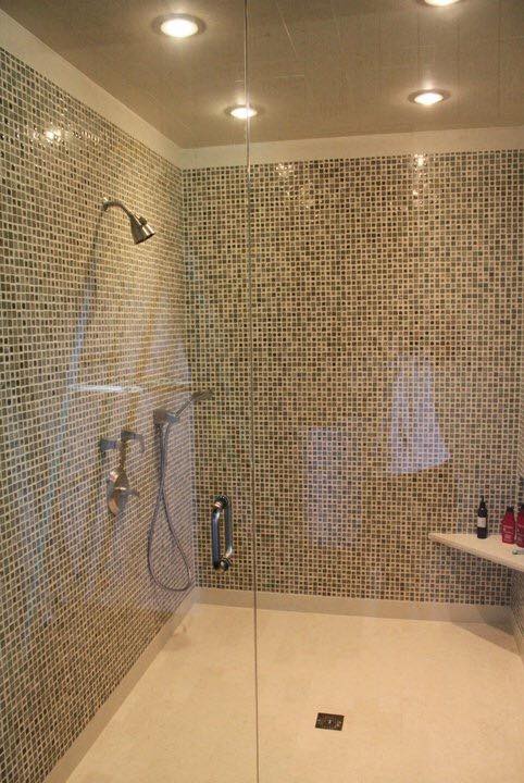 Luxury walk-in shower remodel with mosaic tile, rain head, and frameless glass — Tincher's Custom Homes